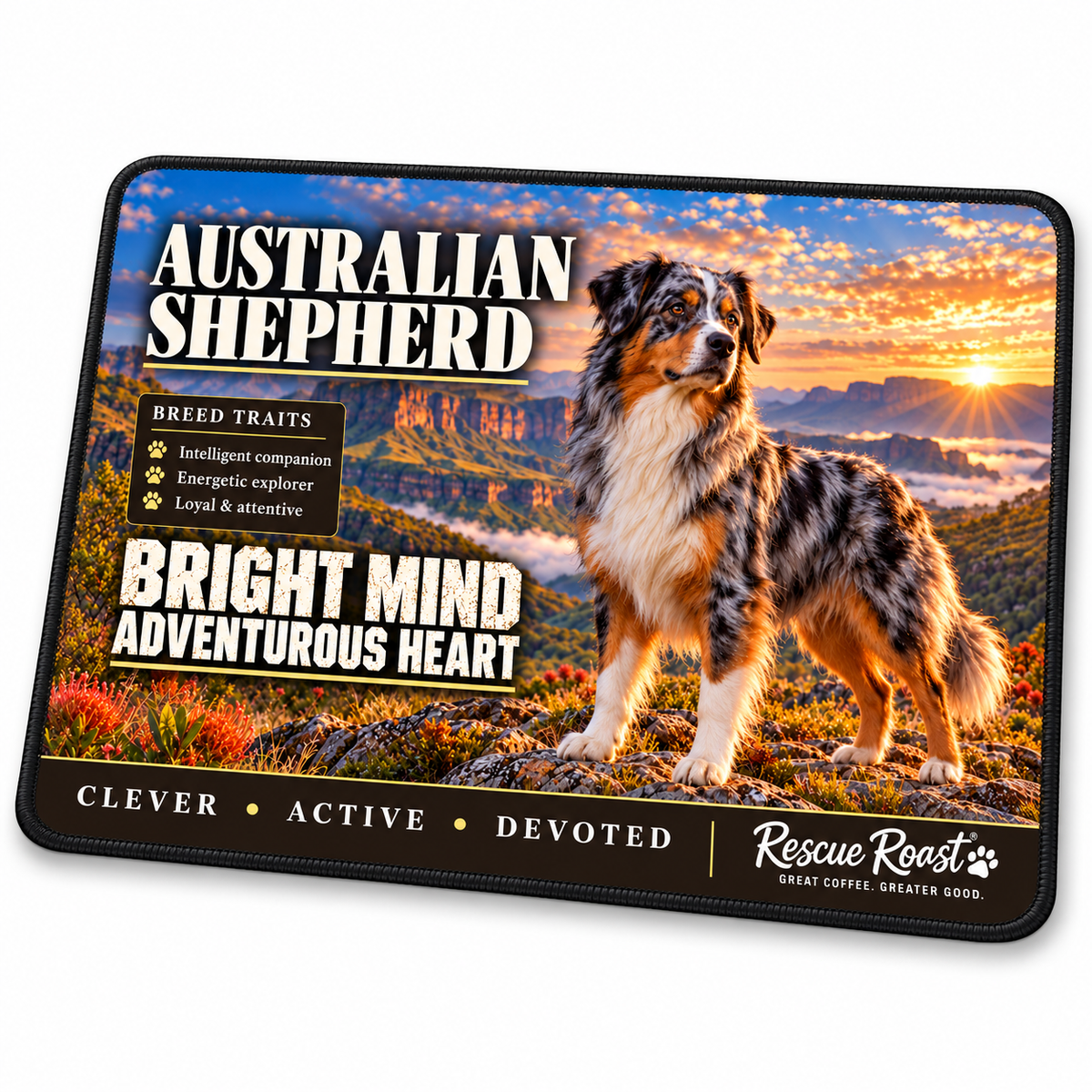 Rescue Roast® Australian Shepherd mousepad: Blue merle Australian Shepherd standing on a mountain lookout at sunset, with the words “Bright Mind, Adventurous Heart”