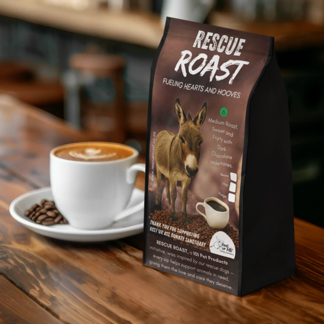 Rescue Roast® Kickback Roast (Rest Ur Ass Donkey Sanctuary), Blend #1 packaging featuring animal artwork, beside a cup