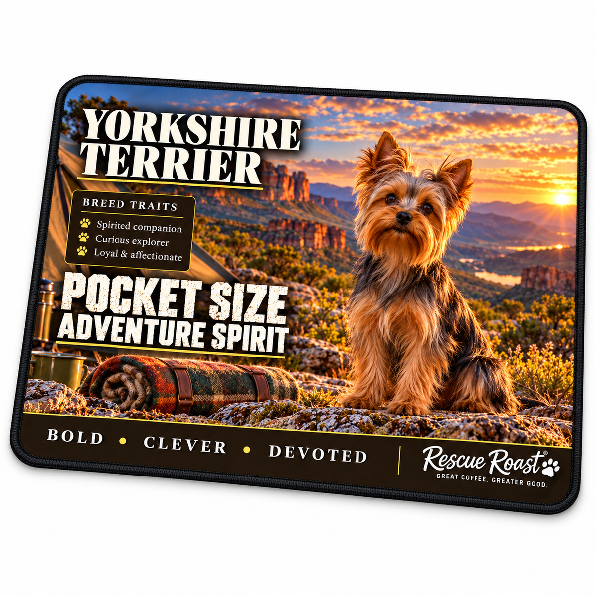 Rescue Roast Yorkshire Terrier mousepad: A Yorkshire Terrier sits at a mountain campsite beside a tent, enamel mug and rolled blanket at sunset. Printed slogan: Pocket Size, Adventure Spirit.
